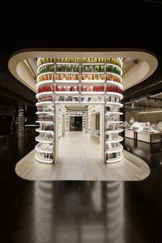 the inside of a building with many shelves filled with books