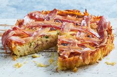 bacon and cheese quiche with one slice cut out