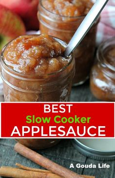 the best slow cooker applesauce recipe in a jar with cinnamon sticks and apple slices