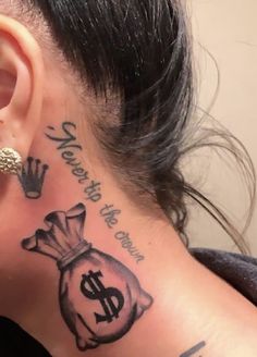 a woman with tattoos on her neck and behind her ear is a bag of money