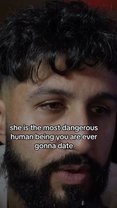 a man with a beard is looking at the camera and has a quote on it