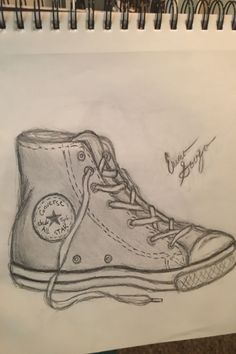 a drawing of a pair of shoes with the word converse written on it and an autographed person's name