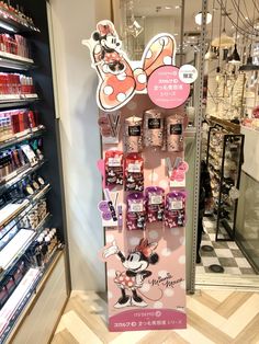 a display in a store with minnie mouse stickers on it's wall and shelves