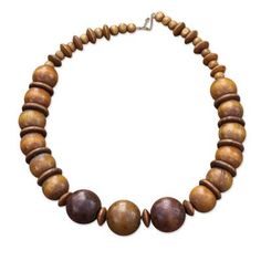 Carrying a promise of beauty wherever it goes this necklace is designed and crafted by Ghanaian artisan Tina Quaye. She carefully selects round beads and discs of brown sese wood that alternate creating a pleasing pattern. Luxury Statement Jewelry With Wooden Beads, Africa Necklace, Wood Bead Necklace, Buy Wood, Necklace Craft, Wood Necklace, Bone Beads, African Beads, Jasper Beads