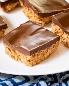 chocolate and peanut butter bars on a white plate