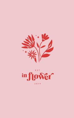 a red flower with the words in flower written below it on a light pink background