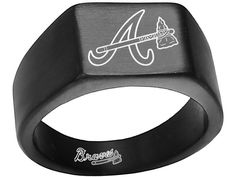 a black ring with the letter a on it and an arrow in white ink is shown