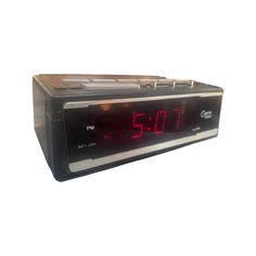 an alarm clock sitting on top of a table