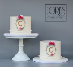 three white cakes with red flowers on them