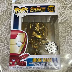 an iron man figurine is in the packaging