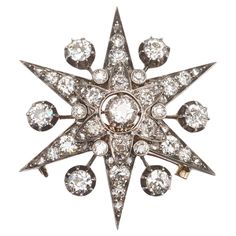 An antique diamond six point star brooch and hair pin, with rays, with an old-cut diamond, in a cut down setting, in the centre, with an air gap surrounded by a flower, grain set with old-cut and rose-cut diamonds, with old cut diamonds in rub over settings between the petals, superimposed on a six pointed star, each ray is set with two, graduating, old-cut diamonds and three rose-cut diamonds, in grain settings; with single diamond rays, in cut down settings, on knife edge stalks, between the p Star Brooch, Jewelry Antique, Antique Brooches, Jewelry Organizer Box, Diamond Brooch, Pin Pendant, Diamond Star, Star Jewelry, Jewelry Armoire