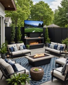 an outdoor living area with couches, chairs and a fire pit in the middle