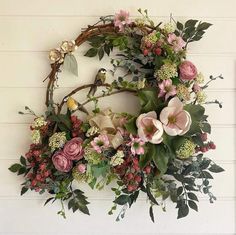 a floral wreath hanging on the wall