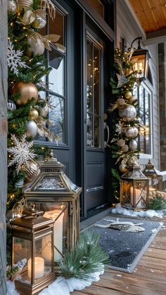 a christmas porch decorated with gold and silver ornaments, lanterns and snowflakes