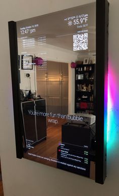 a mirror reflecting the inside of a room with various items on it and an advertise