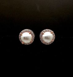 Rose gold plated brass halo round stud post earrings with cubic zirconia deco. Rhodium plated steel post. Swarovski crystal pearl in cream or white half pearl in the center. Elegant and lovely Post is in the center. Size: 1.15cm diameter. 8mm center pearl. Matching necklace https://www.etsy.com/listing/462464450/wedding-jewelry-bridal-necklace-prom?ref=listings_manager_grid Elegant Bridal Earrings With Halo Setting, Fine Jewelry Bridal Earrings With Sparkling Stones, Rose Gold Cubic Zirconia Bridal Earrings For Formal Events, Rose Gold Cubic Zirconia Bridal Earrings For Formal Occasions, Elegant Rose Gold Earrings With Cubic Zirconia, Rose Gold Cubic Zirconia Bridal Earrings, Formal Rose Gold Bridal Earrings With Cubic Zirconia, Elegant Rose Gold Cubic Zirconia Earrings, Elegant Round Halo Setting Earrings