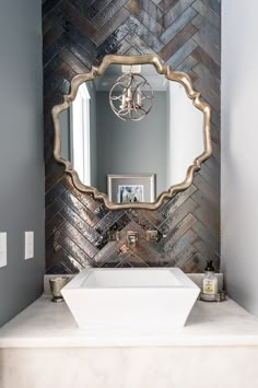 a bathroom sink with a mirror above it