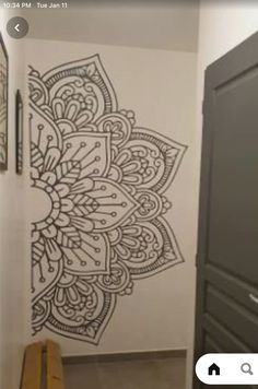 the wall is decorated with an intricately designed design on it's back side