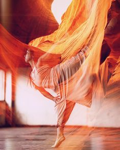 a woman is dancing in an artistic photo