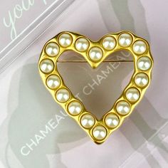 "Givenchy Vintage 80s Glass Pearl Brushed Gold Plated Cut Out Heart Brooch SIGNED. Gorgeous Vintage 80s Givenchy Pearl Heart Brooch. A Lovely Piece Of Perfection By Givenchy. This Superb Brooch Features A Cut Out Heart Design In A Beautiful Brushed Satin Gold Plated Finish And Is Covered In Luminescent Glass Pearl Cabochons. Made Of Gold Plate With Classic Pin Back. An Outstanding Piece By Givenchy, The Large Size Of This Striking Brooch Makes For A Bold Statement. It is Truly A Magnificent Broo Vintage Heart Brooch, Vintage Gold Brooch With Cabochon, Vintage Gold Pearl Brooches, Vintage Heart Shaped Collectible Brooch, Givenchy Jewelry, Luxury Vintage Brooch With Pearl Pendant, Green Tissue Paper, Vintage Heart-shaped Collectible Brooch, Pearl Heart