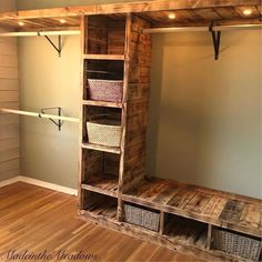 a room with some shelves and baskets in it