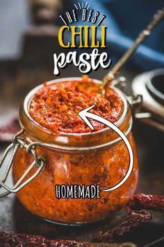 chili paste in a glass jar with an arrow pointing to the top and labeled homemade