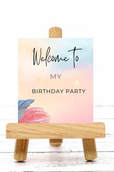 a wooden easel holding a welcome card with the words, welcome to my birthday party