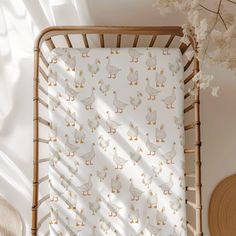 a baby's crib with ducks on it