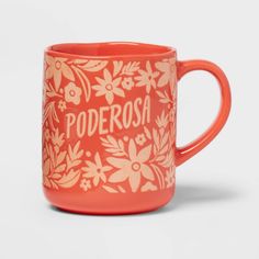 an orange mug with the words poderoosa printed on it