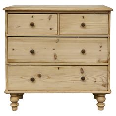 a wooden dresser with three drawers on one side and two knobs on the other