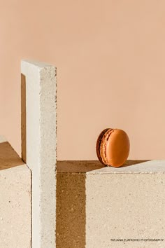 an egg sitting on top of a block of concrete