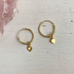 "\"Heart of Gold\" hoop earrings materials  - 6.5mm gold vermeil heart charm - 14mm gold vermeil hoops These earrings come on a card made from biodegradable plantable seed paper, complete with the caption \"heart of gold\". Instagram: @gypsy_sol_lifestyle" Handmade Dainty Gold Huggie Earrings, Handmade Gold Dainty Huggie Earrings, Tiny Small Hoop Earrings As Gift, Gift Small Hoop Earrings, Tiny Hoop Huggie Earrings As Gift, 14k Gold Filled Hoop Earrings For Gift, Tiny Huggie Earrings Small Hoop Gift, Tiny 14k Gold Filled Hoop Earrings For Gift, Recycled Gold Hoop Earrings For Gift