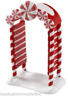 a red and white arch decorated with candy canes