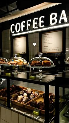 a coffee bar filled with lots of different types of pastries