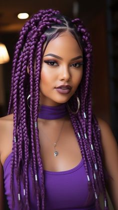 Make a bold statement with these vibrant Purple Box Braids, a stunning choice from our curated collection. Embrace the playful yet sophisticated allure of purple, adding a pop of color and personality to your look. Explore our article for more inspiring braided hairstyles and click the pin to join our community for endless hair inspiration! #PurpleBoxBraids #MediumBoxBraids #BraidHairstyles #HairInspiration Braided Hair With Color, Dark Purple Box Braids, Purple Goddess Braids, Purple Braids For Black Women, Purple Hair Braids, Box Hairstyles, Purple Braiding Hair, Braids Colors, Purple Box Braids