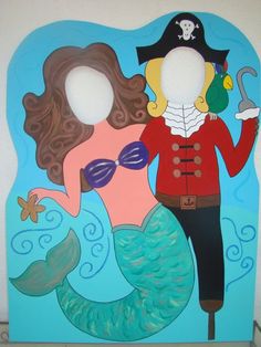 a cardboard cutout of a mermaid and pirate