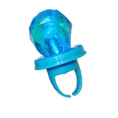 a blue baby pacifier sitting on top of a white wall