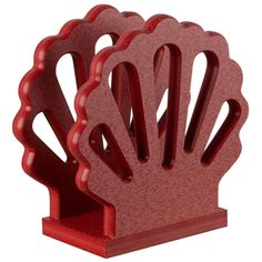 a red plastic shell shaped bookend on a white background with clipping for text