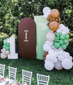 a football themed party with balloons and decorations