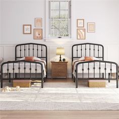 two metal beds sitting next to each other on top of a white carpeted floor