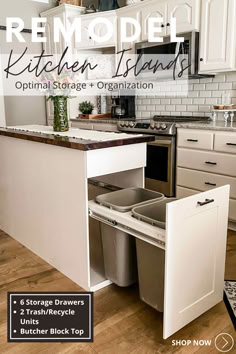 the kitchen island has two trash cans in it and is open to reveal storage space