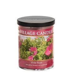 a candle with pink flowers in it on a white background and the words village candle