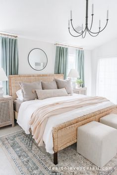 a large bed sitting next to a window in a bedroom