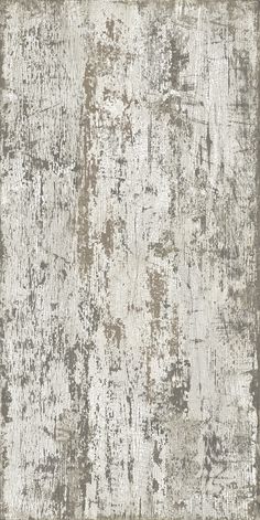 an old, worn and stained rug with faded paint on the edges in grey tones