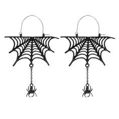 two spider web earrings hanging from hooks