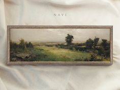 an old painting hanging on the wall next to a white sheet that says navi