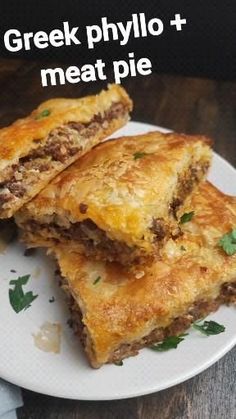 two pieces of food on a plate with the words greek phylo and meat pie