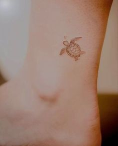 a small turtle tattoo on the ankle