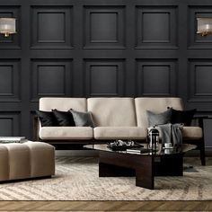 a living room with black walls and wooden flooring is shown in this image, there are two couches on the coffee table