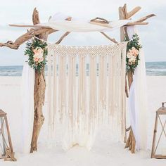 an outdoor wedding ceremony setup on the beach